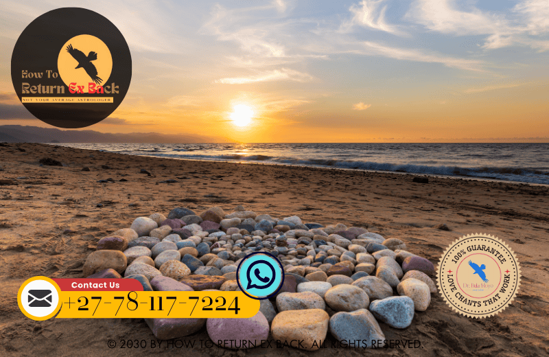 A peaceful scene with a person holding a stone by the ocean, preparing to let go of emotional burdens through a forgiveness ritual