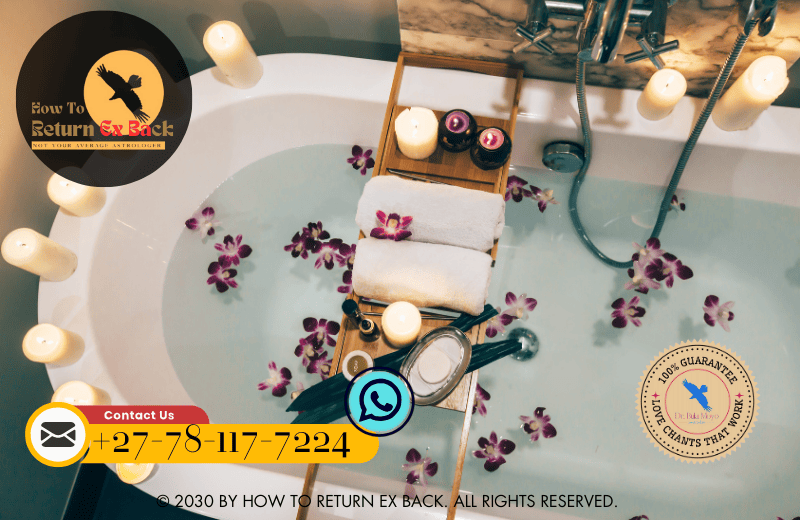 A soothing bath filled with rose petals and candles, representing a ritual bath for emotional cleansing.