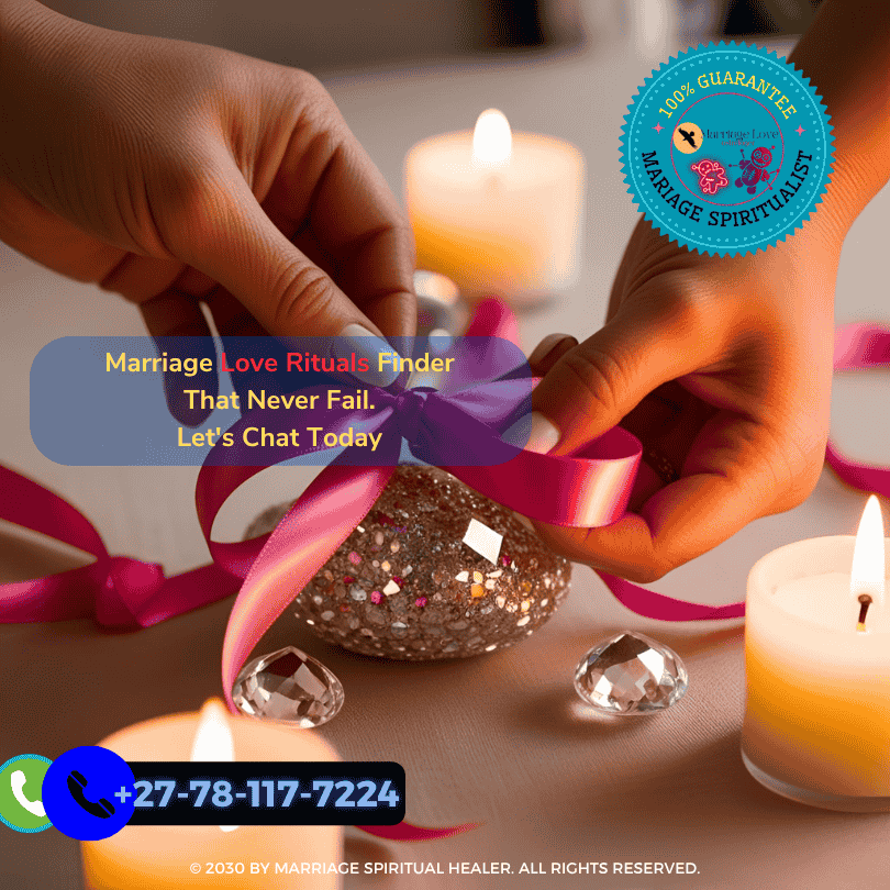 Hands tying a pink ribbon around crystals for re-binding ceremony