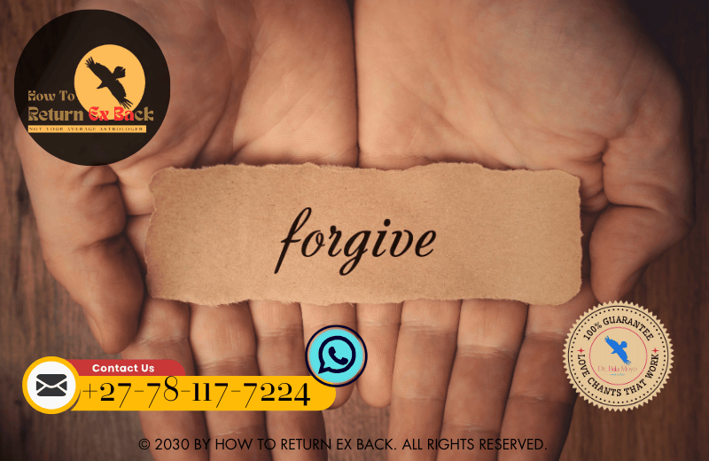 Two intertwined hands holding a symbolic token of forgiveness during a trust-rebuilding ceremony.