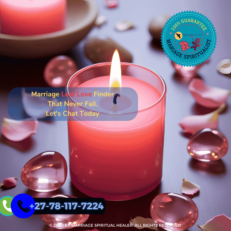 Pink candle surrounded by rose quartz and petals for a love spell ritual